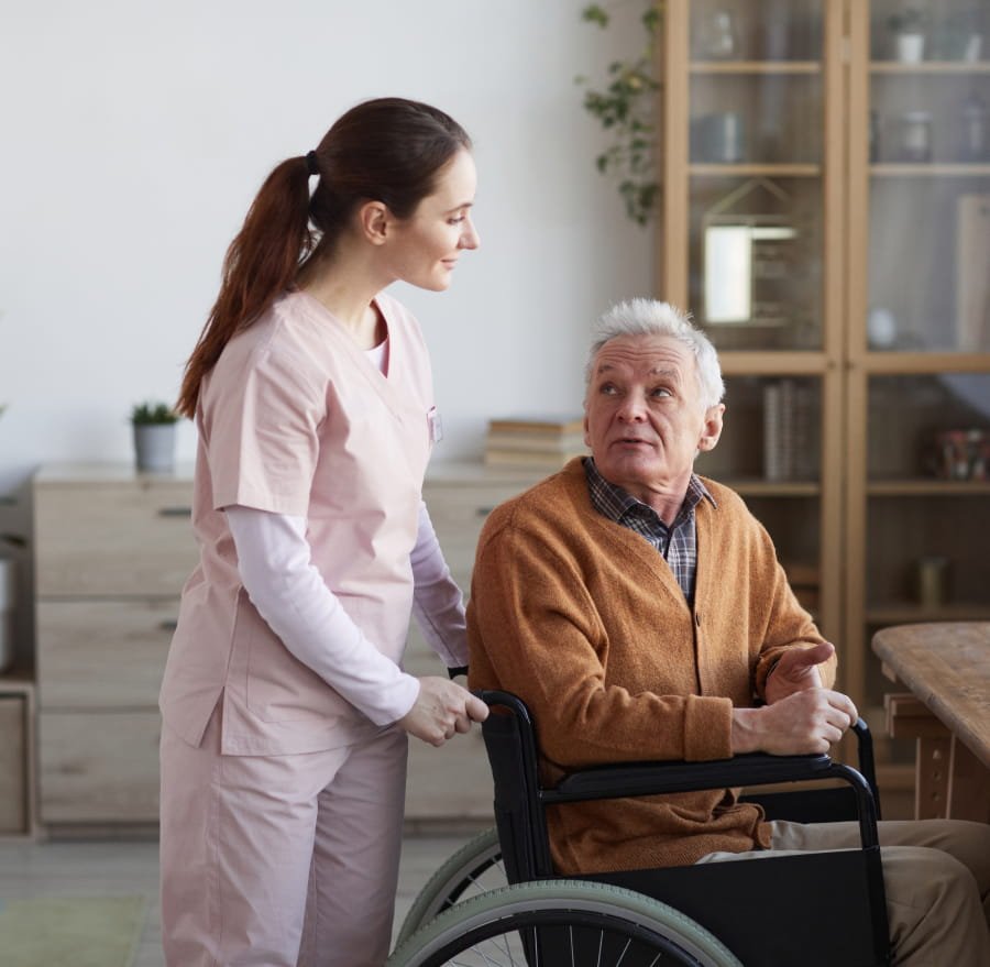 A caregiver walking with a client at home
